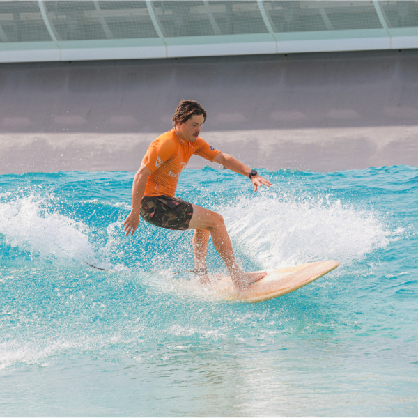 surfing at the wave