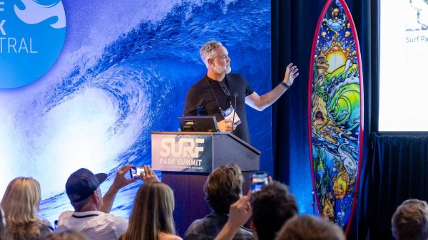 palm valley's Luke Altschwager on stage at Surf Park Summit
