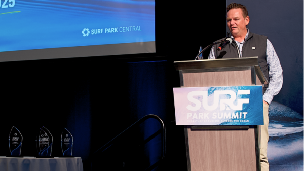 Jess Ponting from Surf Park Central stands at a podium.