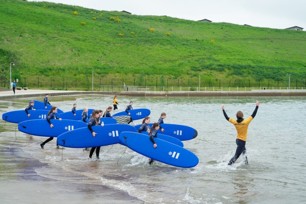 Kids surfing at Lost Shore Surf Resort